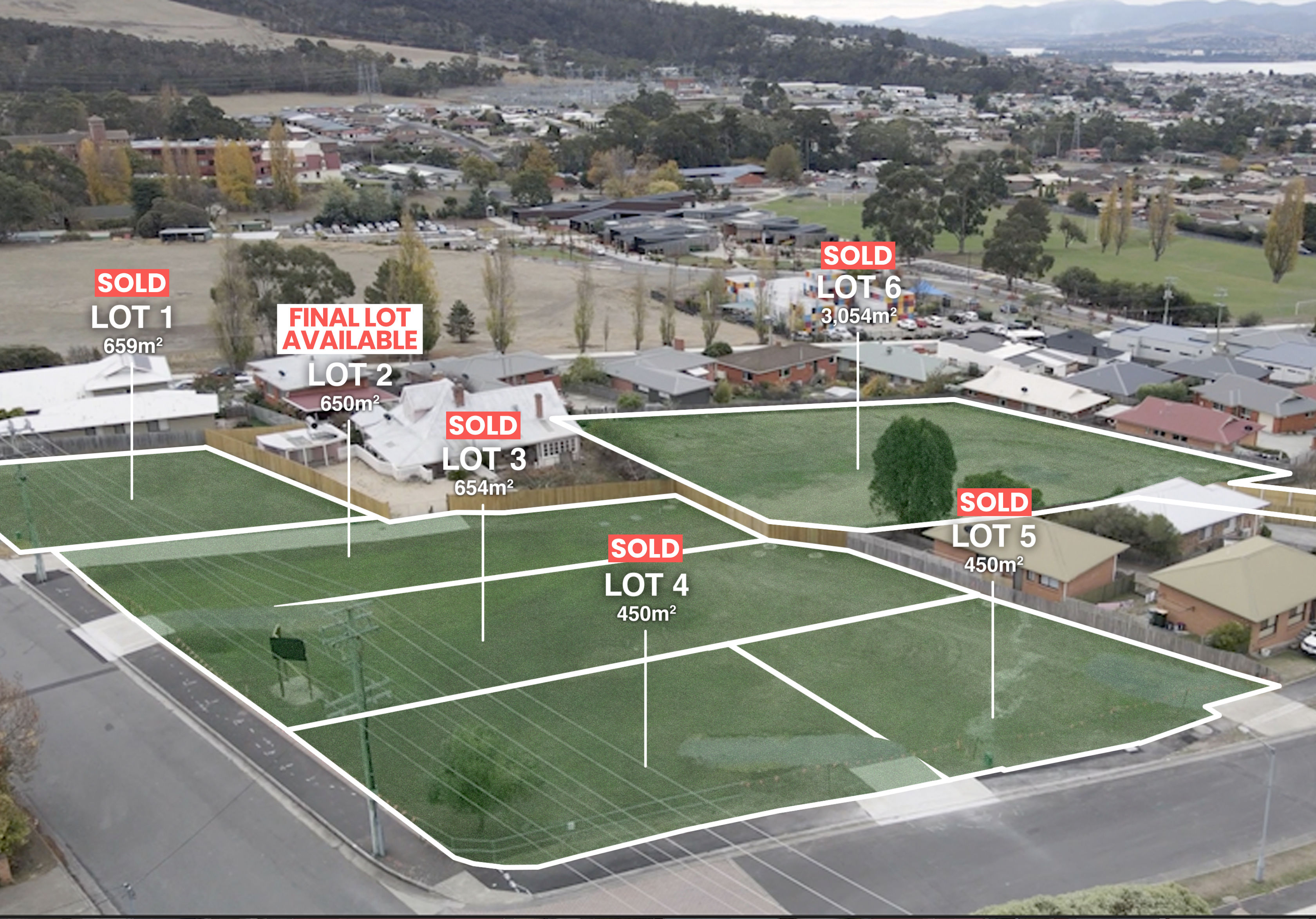 Oblique aerial over the subdivision looking towards the hills and river, with Lot 2 outlined and labelled the final lot available amid mown grass and surrounding Glenorchy streets.
