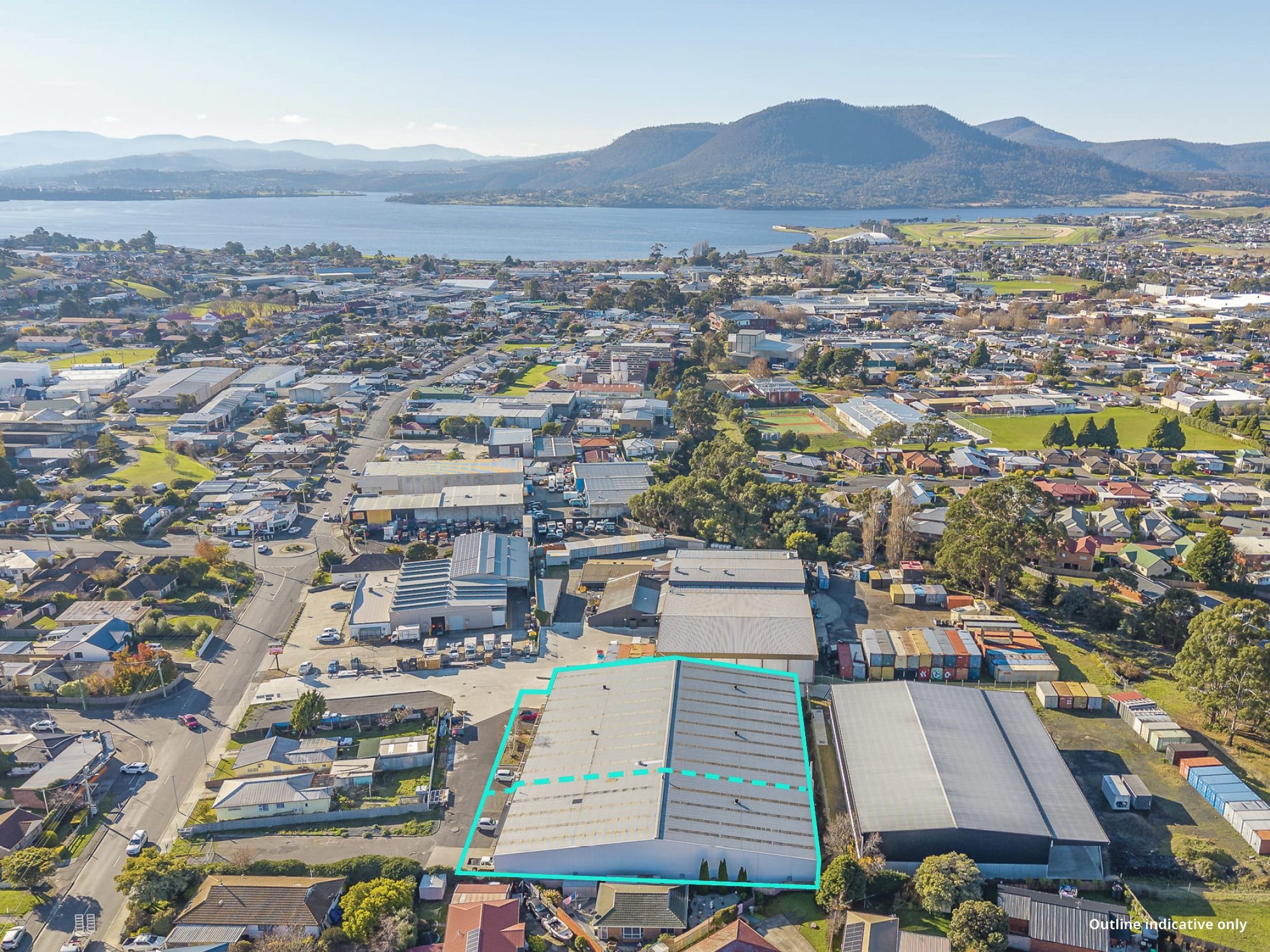 Wide aerial over Glenorchy with the site outlined, and the river and hills beyond. Outline indicative only.
